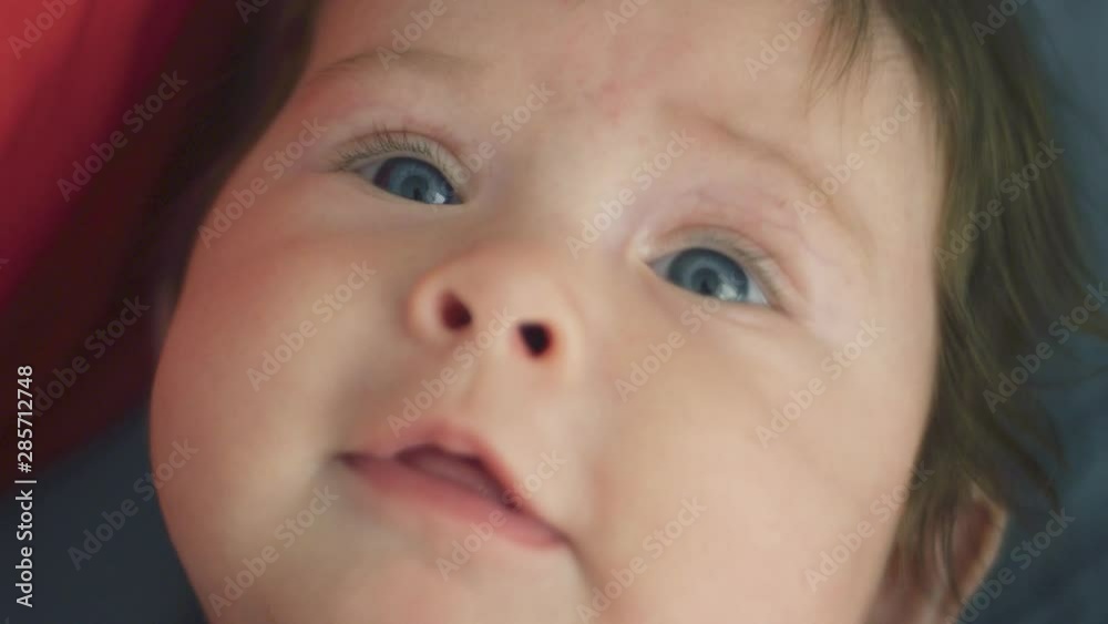Close-up of beautiful baby girl looking at camera Close-up of beautiful baby girl looking at camera