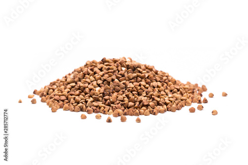 Pile of buckwheat isolated on white background. Top view.