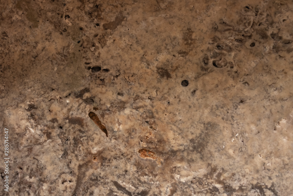 The structure of natural stone. Sand stone. Creative vintage background. Brown natural workpiece.