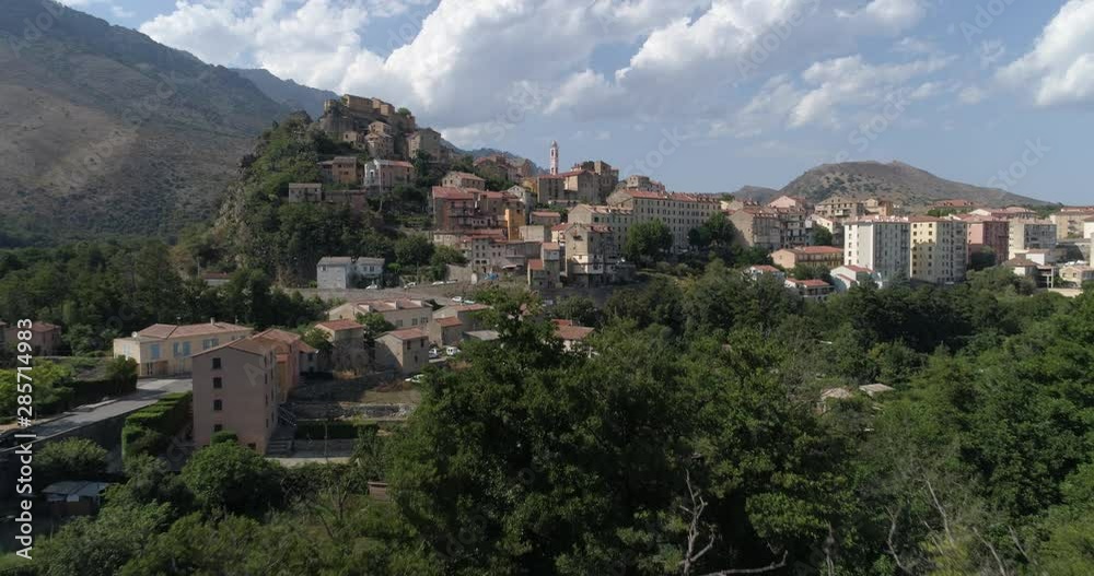 Corte / Corti, appearing behind trees, Corsica