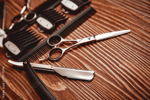Hairdresser barber shop tools on old wooden background, copy space