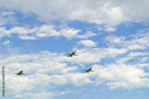 Three supersonic jet bombers in the sky.