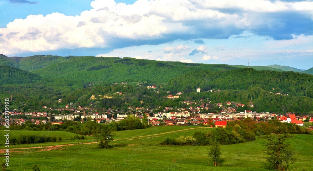 landscape with a rural locality between the hills of Transylvania