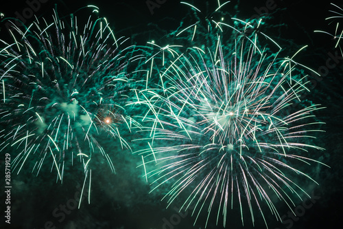 Beautiful fireworks closeup with colorful green lights
