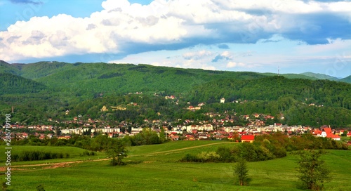 landscape with a rural locality between the hills of Transylvania