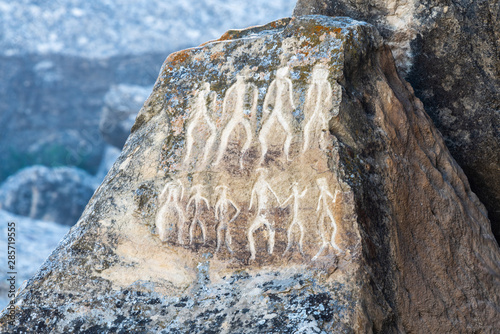 Ancient petroglyph depicting human figures in Gobustan, Azerbaijan.