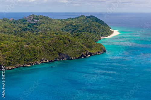 Aerial view from the drone on the landscape tropical sand beach with palm trees. Summer vacation consept.