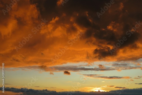 Beautiful fiery orange sunset background over the city © natalya2015