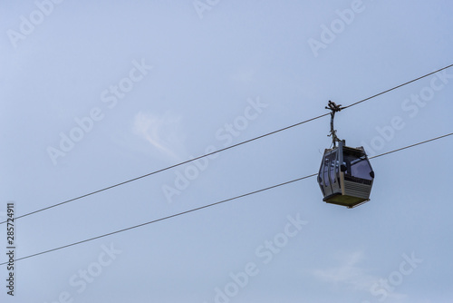 Cable cars transport against blue sky on a sunny day