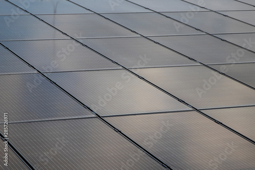 Solar panels at the top of the building. Solar modules on a flat roof.