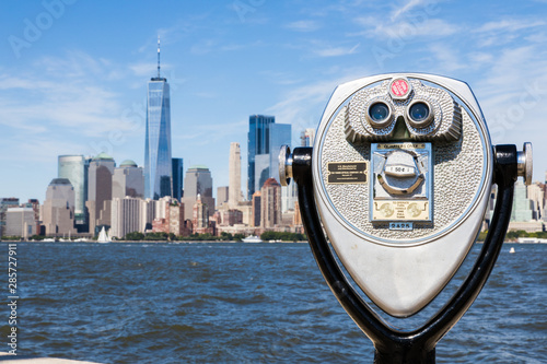 Coin operated binocular in Ellis Island with Freedom tower in background