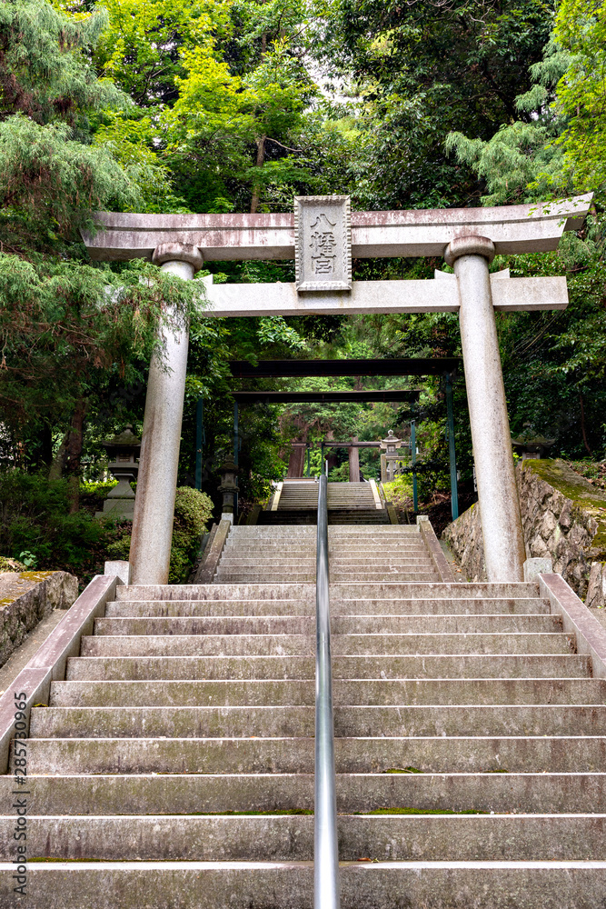 A torii, a gateway to Shiota hachiman-gu shrine in Kobe, Hyogo, Japan. Translation; Japanese characters in the plate put on the gate means A torii, a gateway to Shiota hachiman-gu shrine in Kobe, Hyogo, Japan. Translation; Japanese characters in the plate put on the gate means
