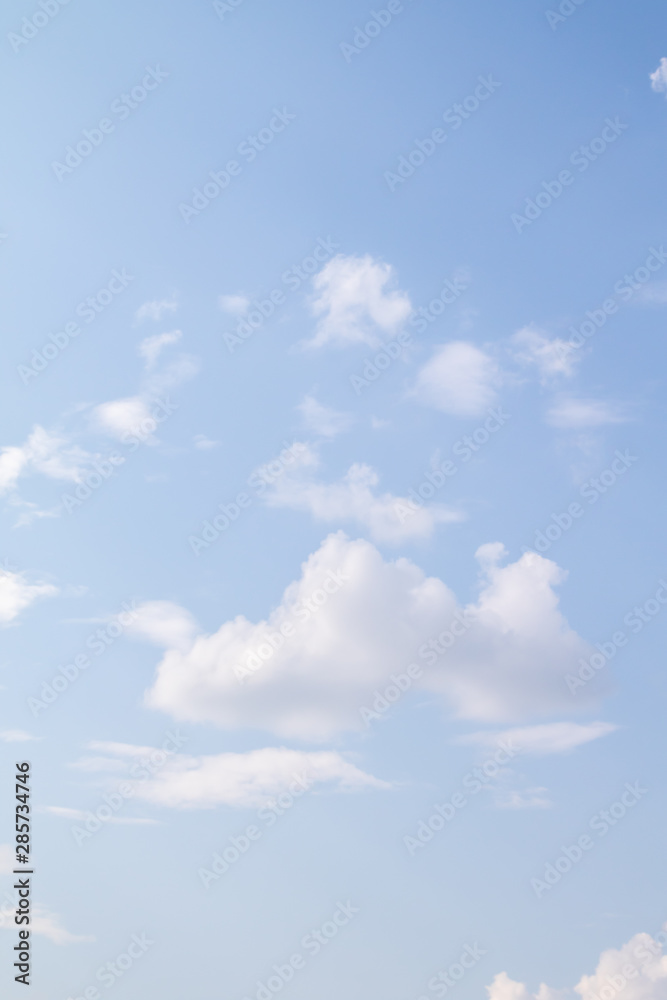 Blue sky with fluffy white clouds all over the background, summer day. Blue sky with fluffy white clouds all over the background, summer day.