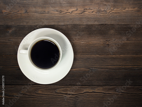 cup of coffee on wooden table