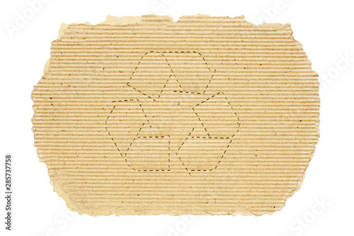 Recycle symbpl on torn of cardboard, isolated on  white background with clipping pathd. photo