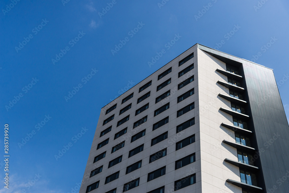 A modern architecture skyscraper against blue sky A modern architecture skyscraper against blue sky