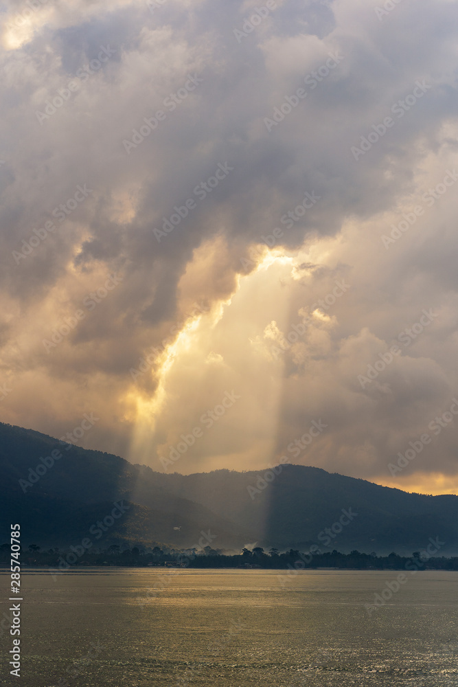 Sunlight through the clouds at dawn, island Koh Samui, Thailand