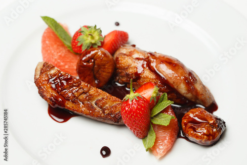 meat in sweet and sour sauce in strawberries and figs