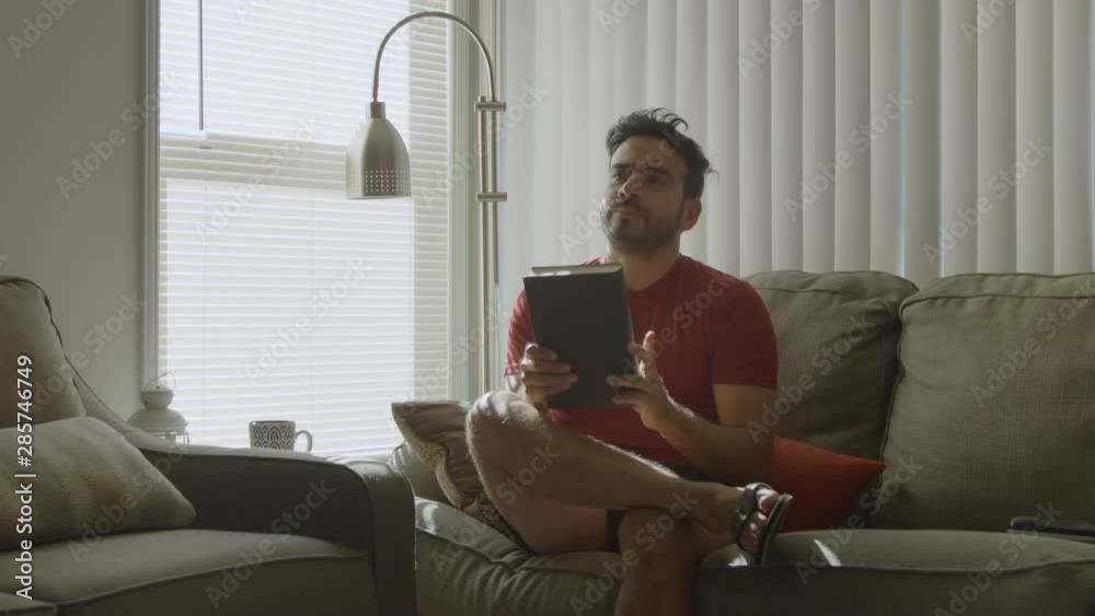 Slow motion of man at home closing a book and reflecting on it Slow motion of man at home closing a book and reflecting on it