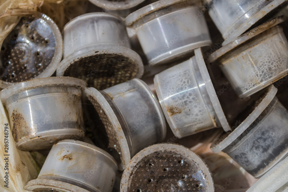 Closeup of used coffee capsules, recycle of plastic single-serve coffee containers, espresso coffee capsules close-up - Image