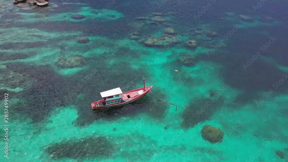 Boats Anchoring in Turquoise Shallow Water by the Edge of Coral Reef. Aerial View