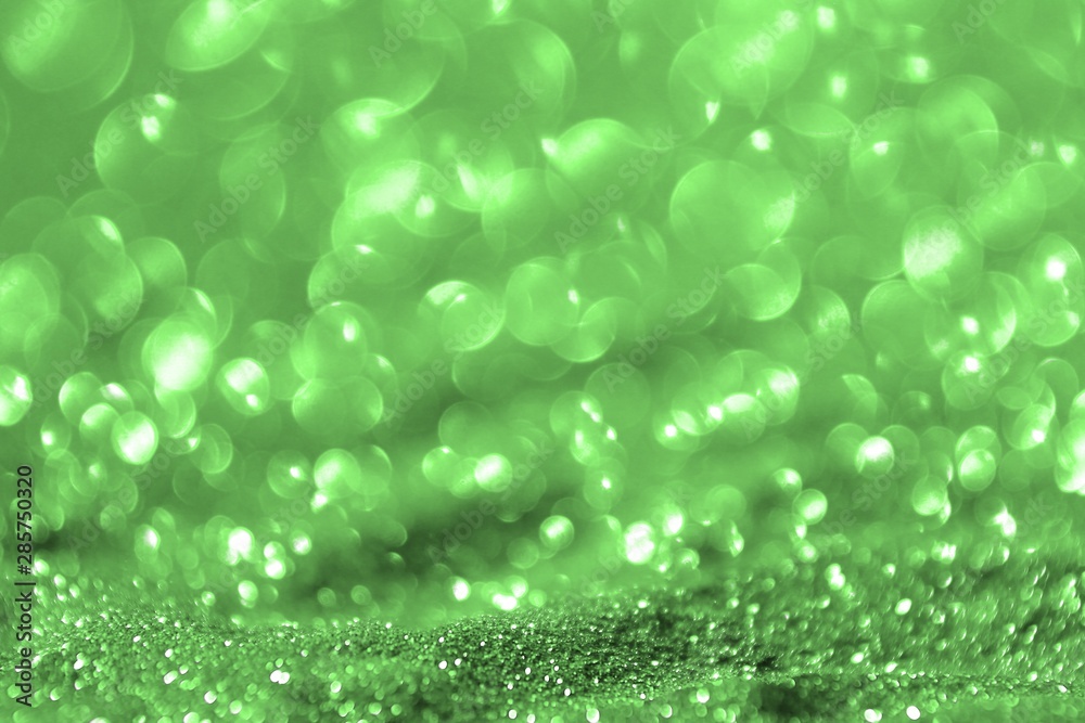 green shining golden sand made of glitters - bright concept with bokeh texture - pretty abstract photo background