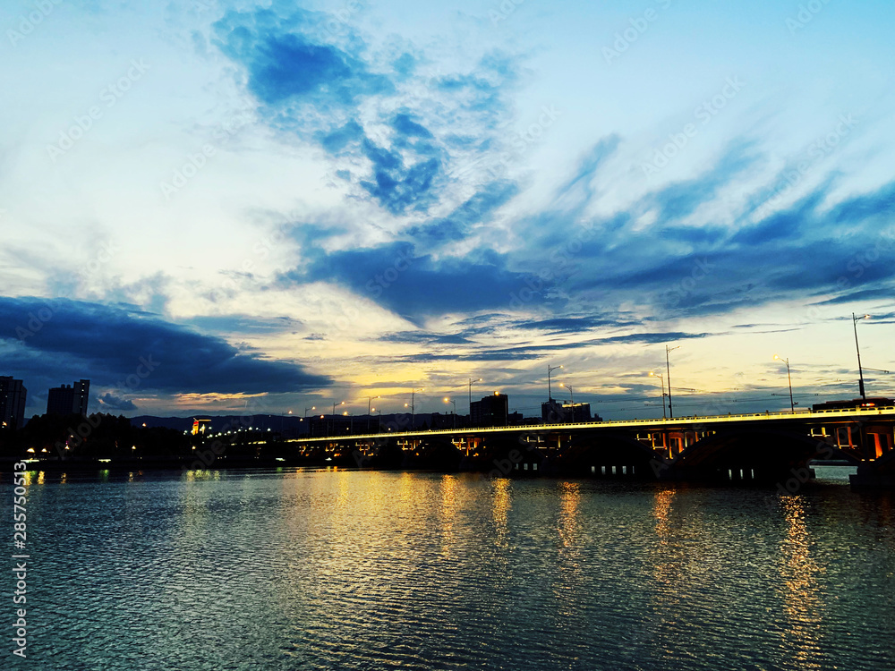 Beautiful bridge in Fen River Park at dusk