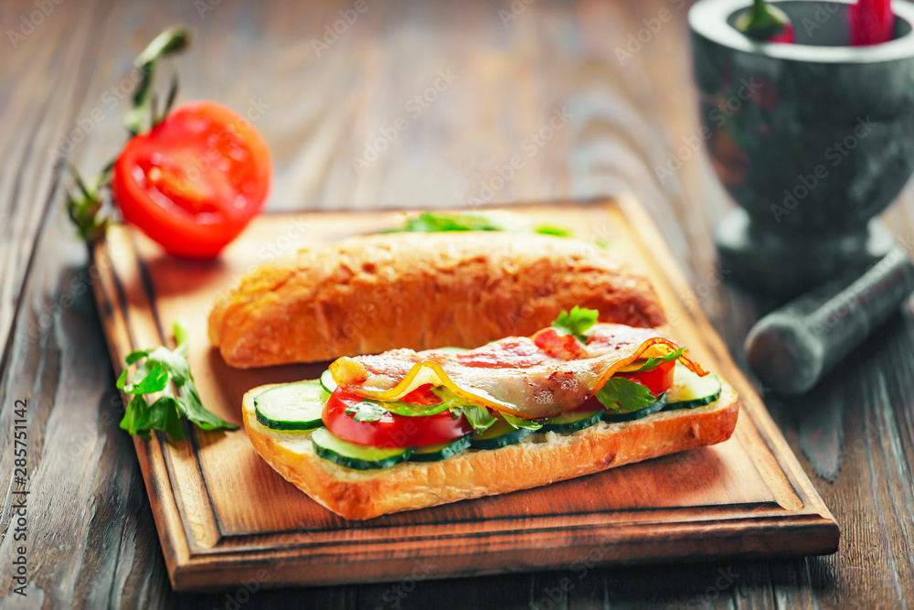 Fresh and tasty sandwich with bacon and vegetables. Breakfast or snack concept. Macros.