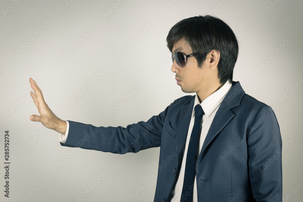Young Asian Portrait Businessman with Stop Hand Pose in Vintage Tone Young Asian Portrait Businessman with Stop Hand Pose in Vintage Tone