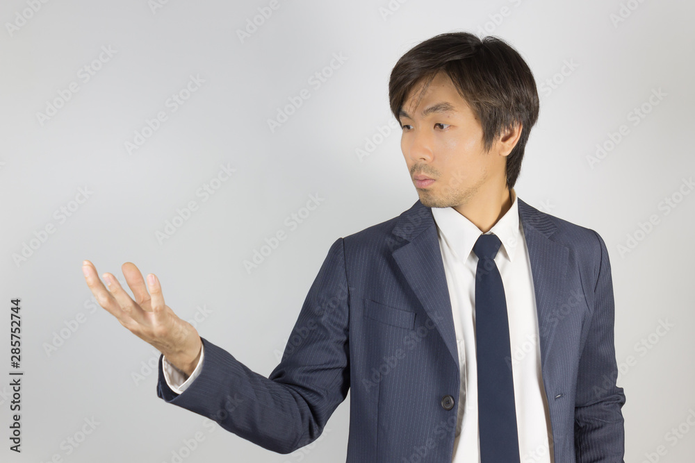 Young Asian Portrait Businessman in Navy Blue Suit Show Hand Young Asian Portrait Businessman in Navy Blue Suit Show Hand