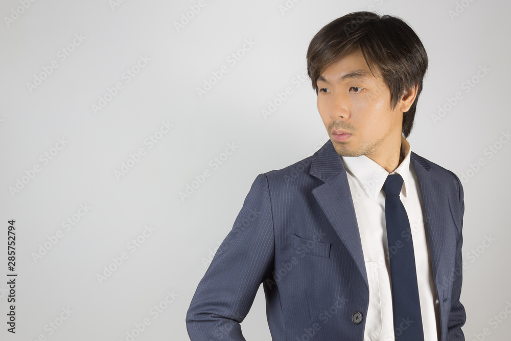 Young Asian Portrait Businessman in Navy Blue Suit Turn Back Pose at Right Frame Young Asian Portrait Businessman in Navy Blue Suit Turn Back Pose at Right Frame