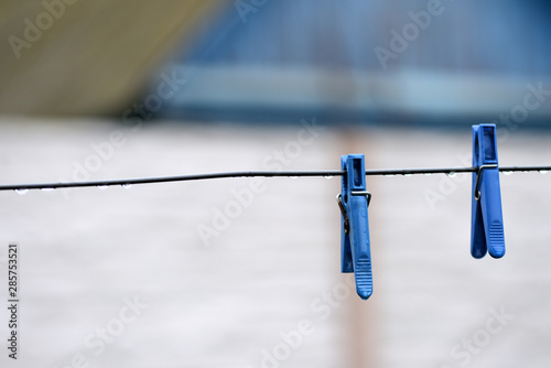 Plastic clotheslines with water drops after rain close up