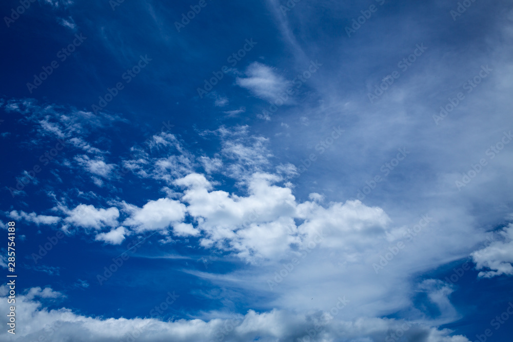 Fototapeta premium Blue sky background with White fluffy clouds