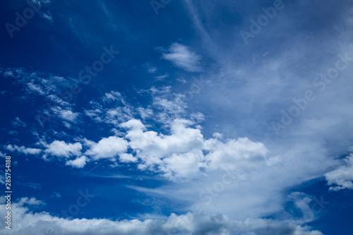 Blue sky background with White fluffy clouds
