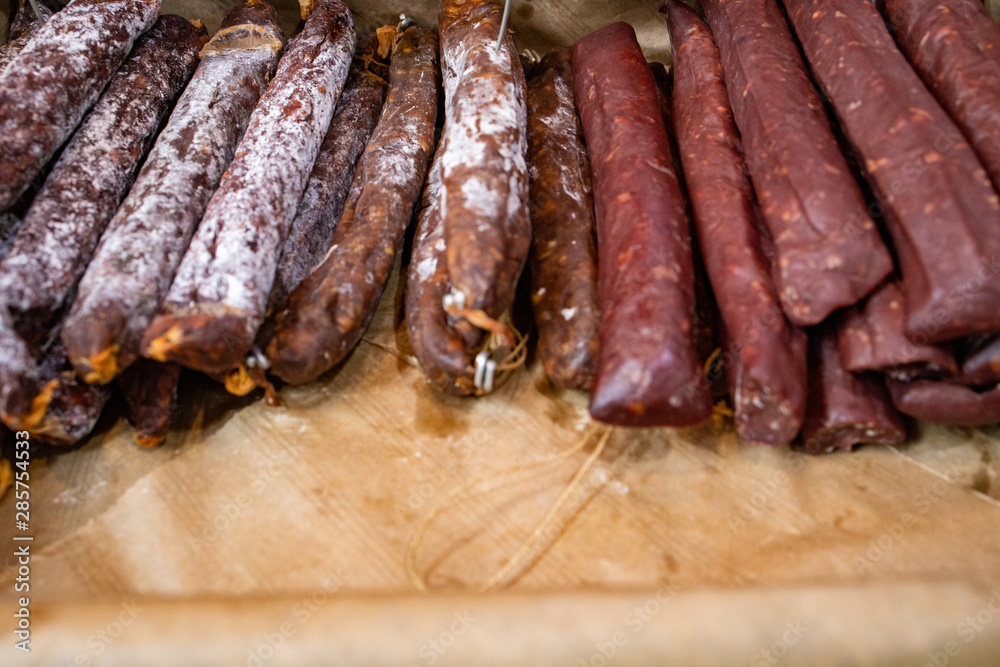Variety of dried sausages in a basket