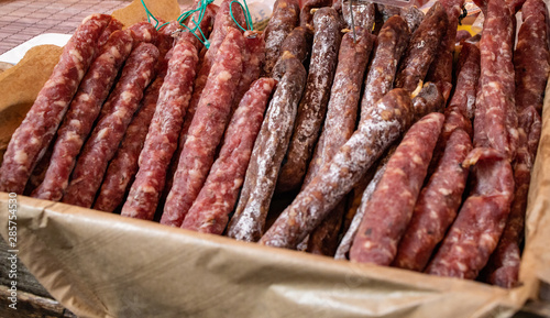 Variety of dried sausages in a basket