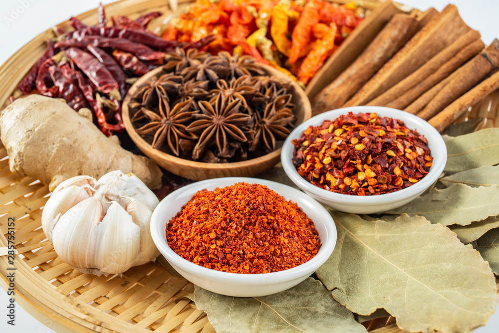 A plate of Chinese food commonly used spicy cooking seasoning spices on a white background A plate of Chinese food commonly used spicy cooking seasoning spices on a white background