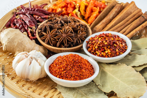 Fototapeta Naklejka Na Ścianę i Meble -  A plate of Chinese food commonly used spicy cooking seasoning spices on a white background
