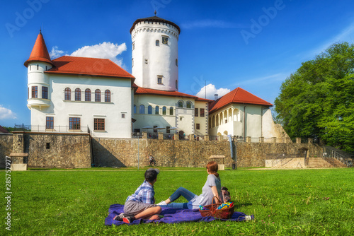 People in park in front of Budatin castle in Zilina, Slovakia photo