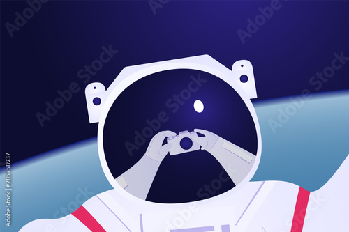 Astronaut taking selfie on the earth background
