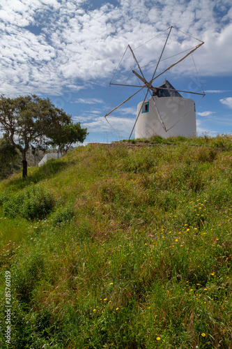 Old windmill on a hill in Odeceixe at the Algarve, Portugal.