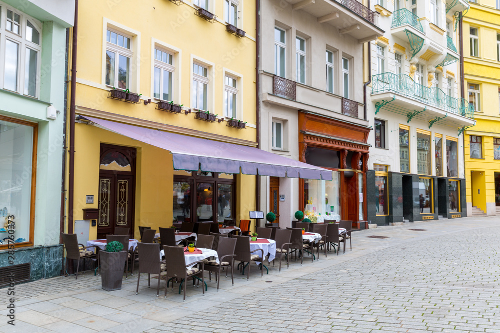 Outdoor cafe on cobblestone street, Karlovy Vary