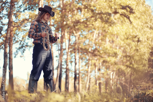 Cowboy with hat in a field in autumn © alexkich