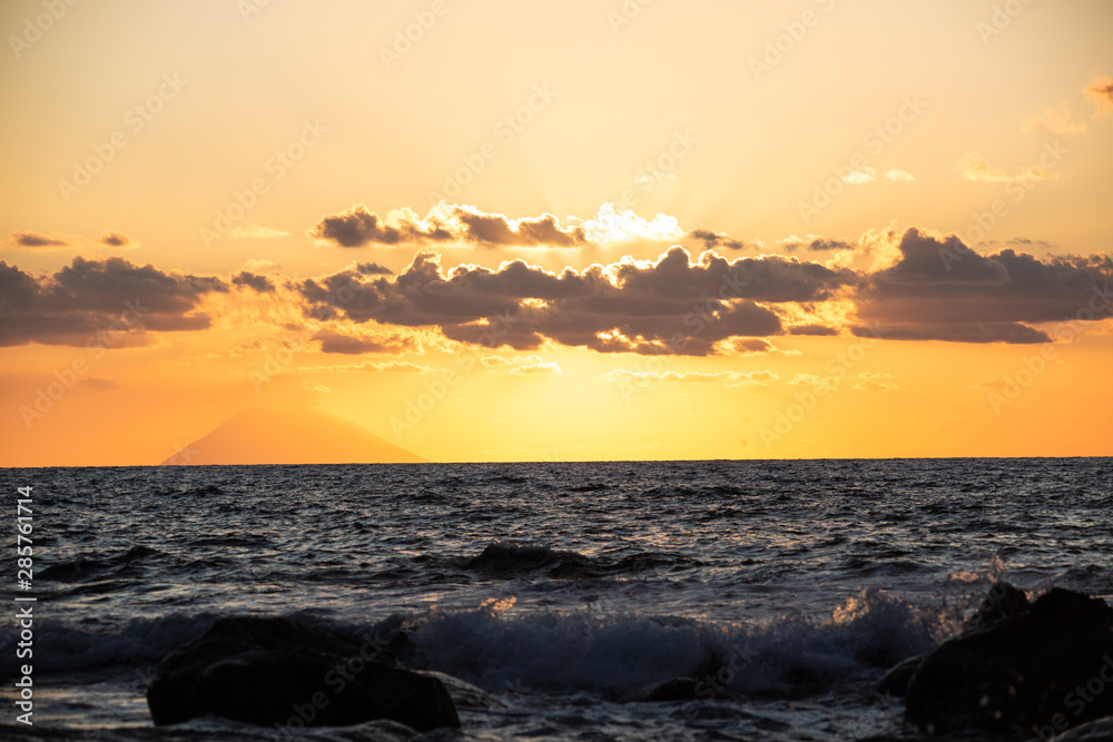 Fototapeta premium Sunset overlooking the Stromboli from Tropea,