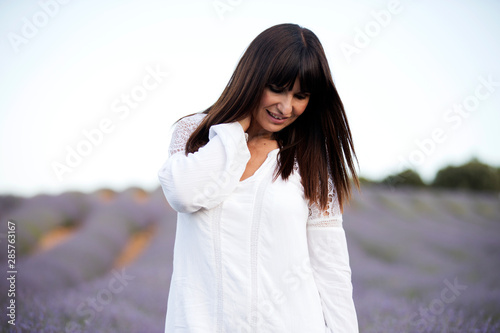 Pretty woman in lavender flowers field © Noelia