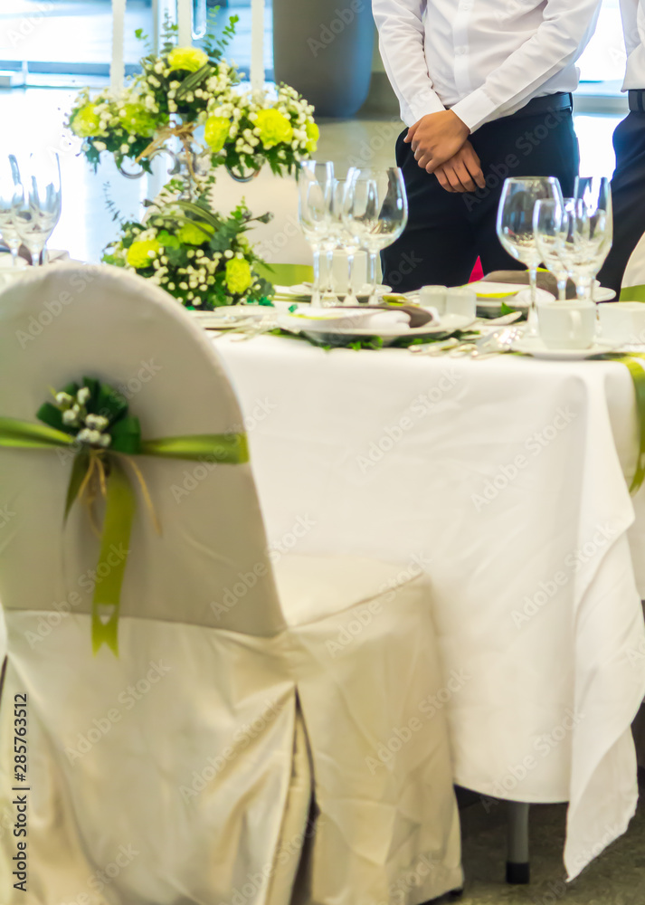 Waiter ready to service at New year dinner in restaurant. Waiter ready to service at New year dinner in restaurant.