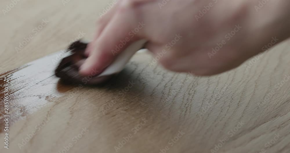Slow motion applying oil finish to oak surface with cloth Slow motion applying oil finish to oak surface with cloth