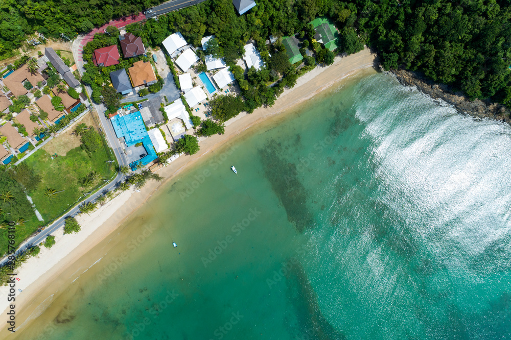 Beautiful sea surface with seashore and modern villa image by Drone aerial view Top down