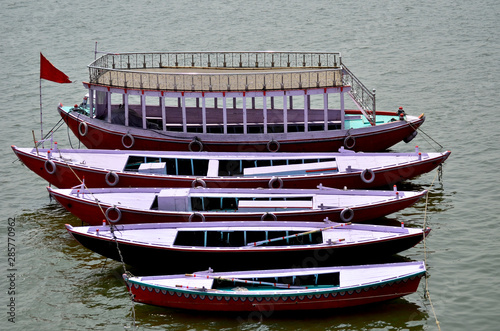 Colored boats on de Ganges river in Varanassi, India photo