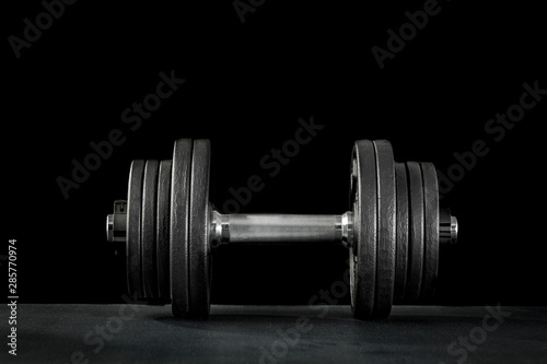 Dumbbell, barbell and workout in the gym. Woman lifting weights.